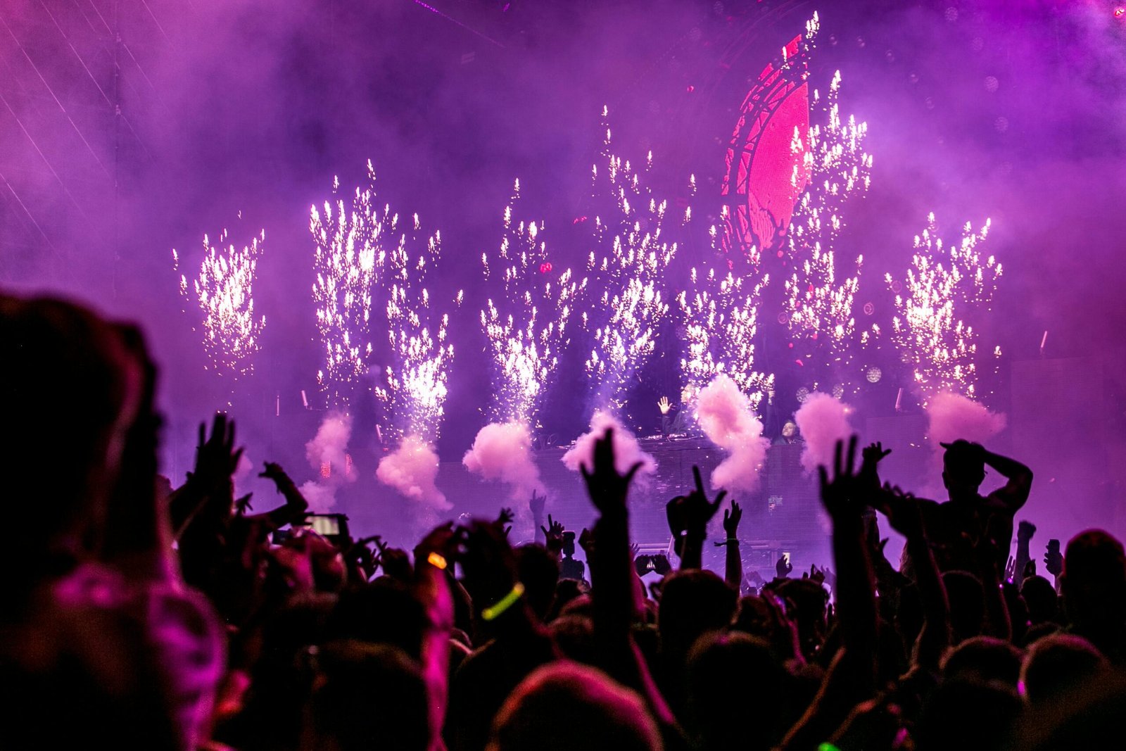 Makati Manila City Tourism: Must Visit Spots and Local Experiences 2 Vibrant EDM concert scene with fireworks, smoke, and enthusiastic crowd enjoying the music.