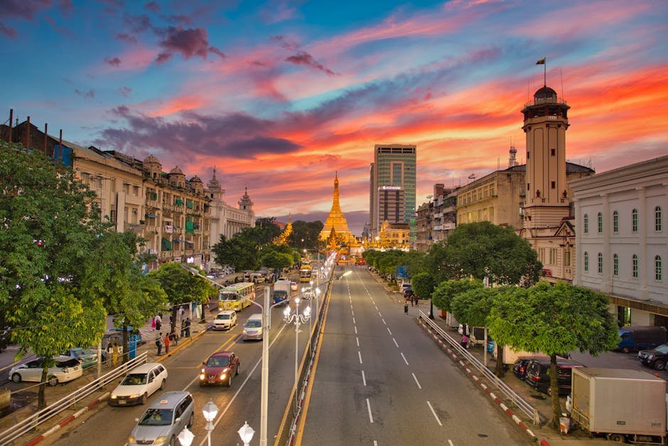 Stunning view of Sule Pagoda in Yangon during sunset, capturing vibrant city life.