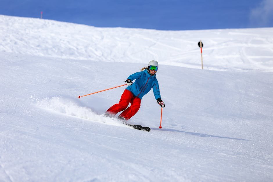 Skier in colorful attire navigating snowy slopes in Vorarlberg, Austria.