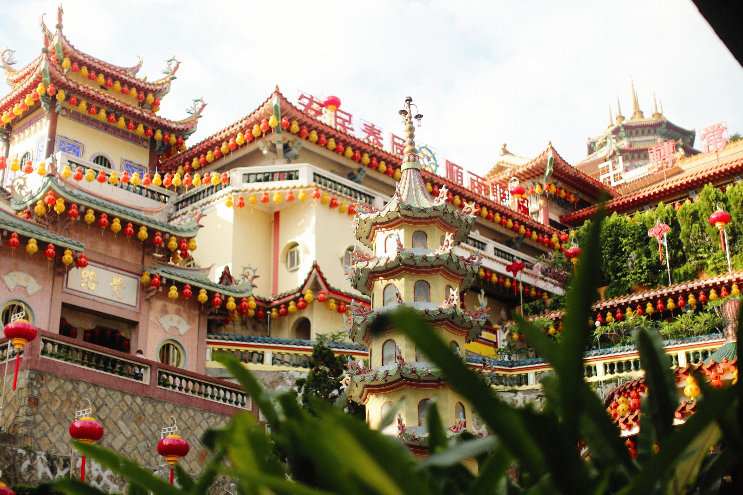 Penang Food Guide: Must try food in Penang 11 Colorful Kek Lok Si Temple in Penang, adorned with lanterns and traditional architectural elements.